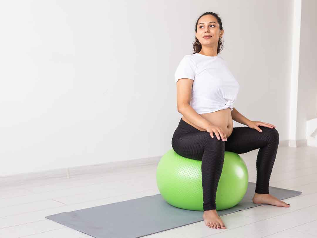 121 Physical Therapy Clarkston, Michigan Pelvic Floor Rehab Pregnant Woman Sitting on Exercise Ball